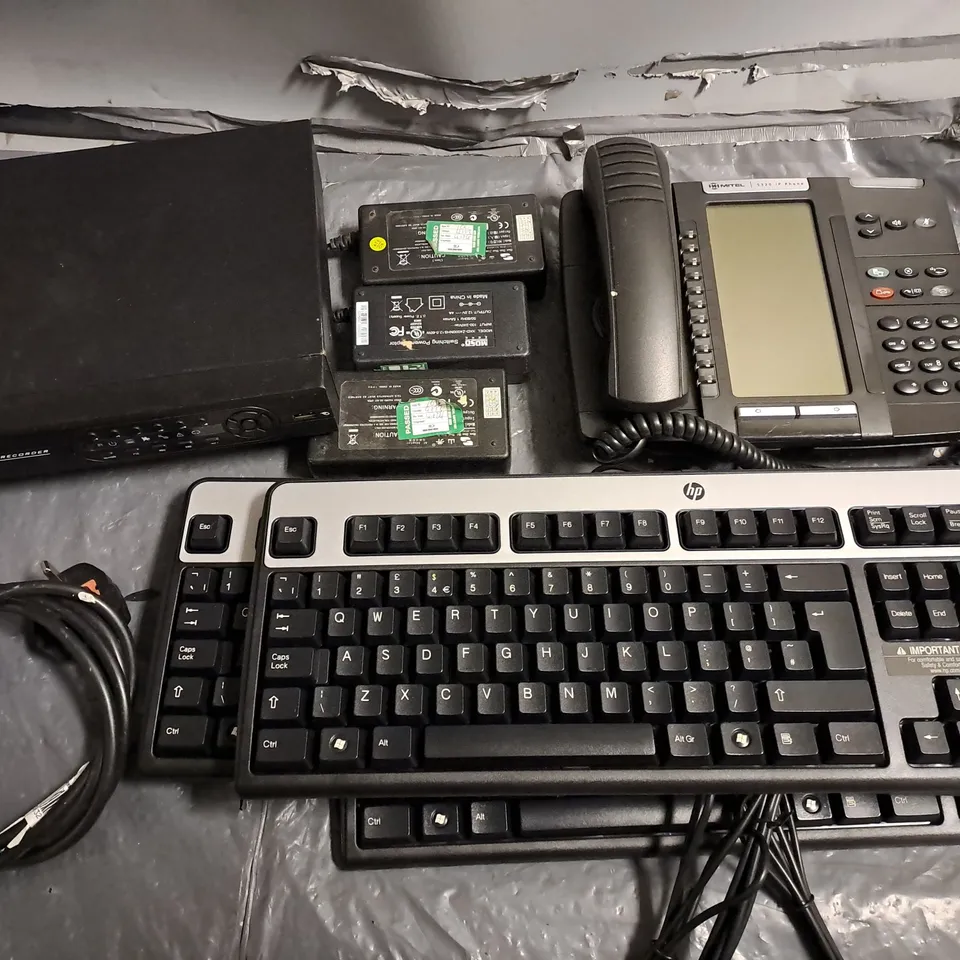 LOT OF ASSORTED TECH ITEMS TO INCLUDE DIGITAL VIDEO RECORDER, HP KEYBOARDS DELL POWER ADAPTERS AND MITEL IP PHONES