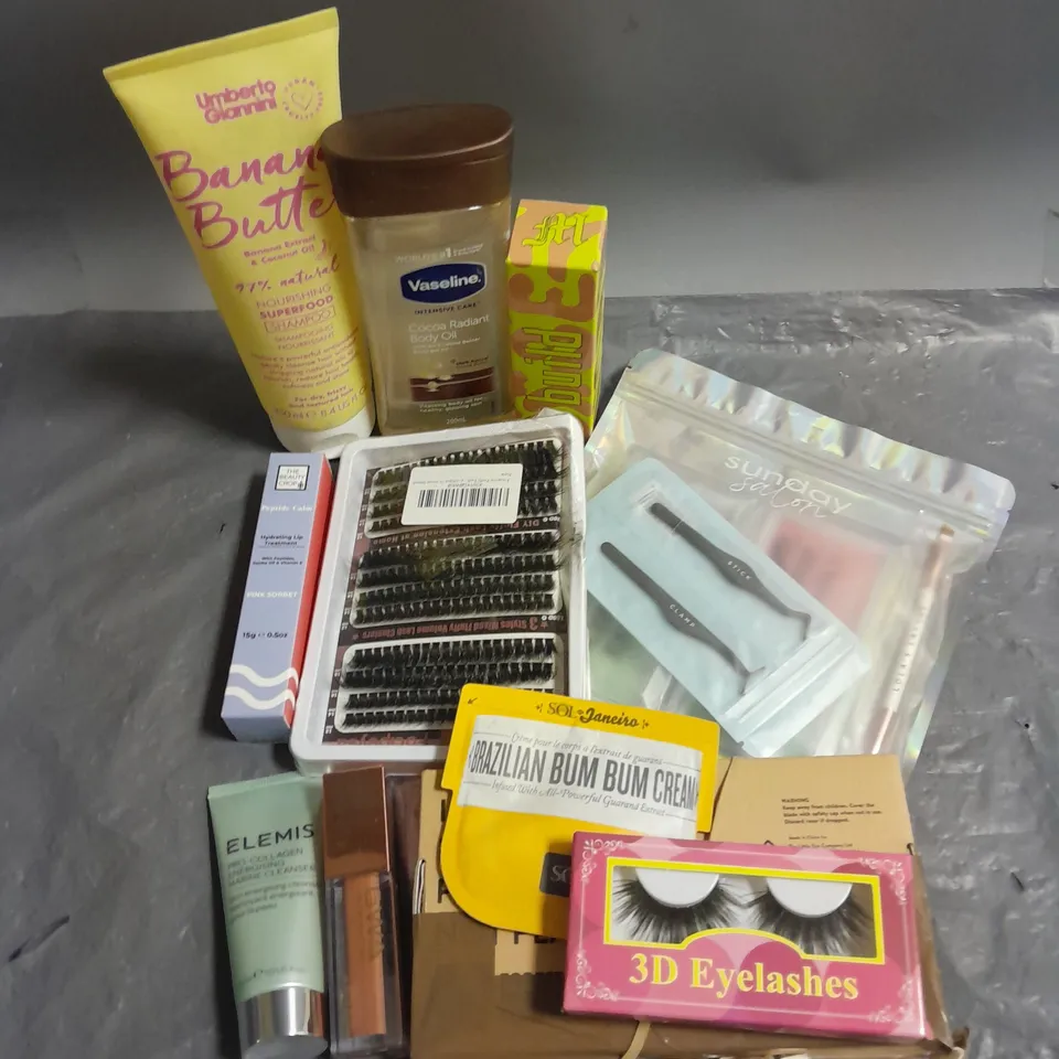 APPROXIMATELY 12 ASSORTED COSMETIC PRODUCTS TO INCLUDE - MADE BY MITCHELL LIQUID FOUNDATION - SUNDAY SALON LASHES - THE BEAUTY CROP HYDRATING LIP TREATMENT - ETC