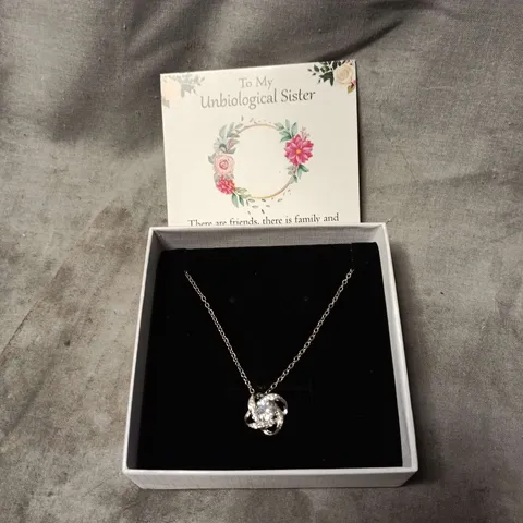 SILVER-TONE NECKLACE WITH CRYSTAL KNOT PENDANT – BOXED. GIFT CARD TO "MY UNBIOLOGICAL SISTER"