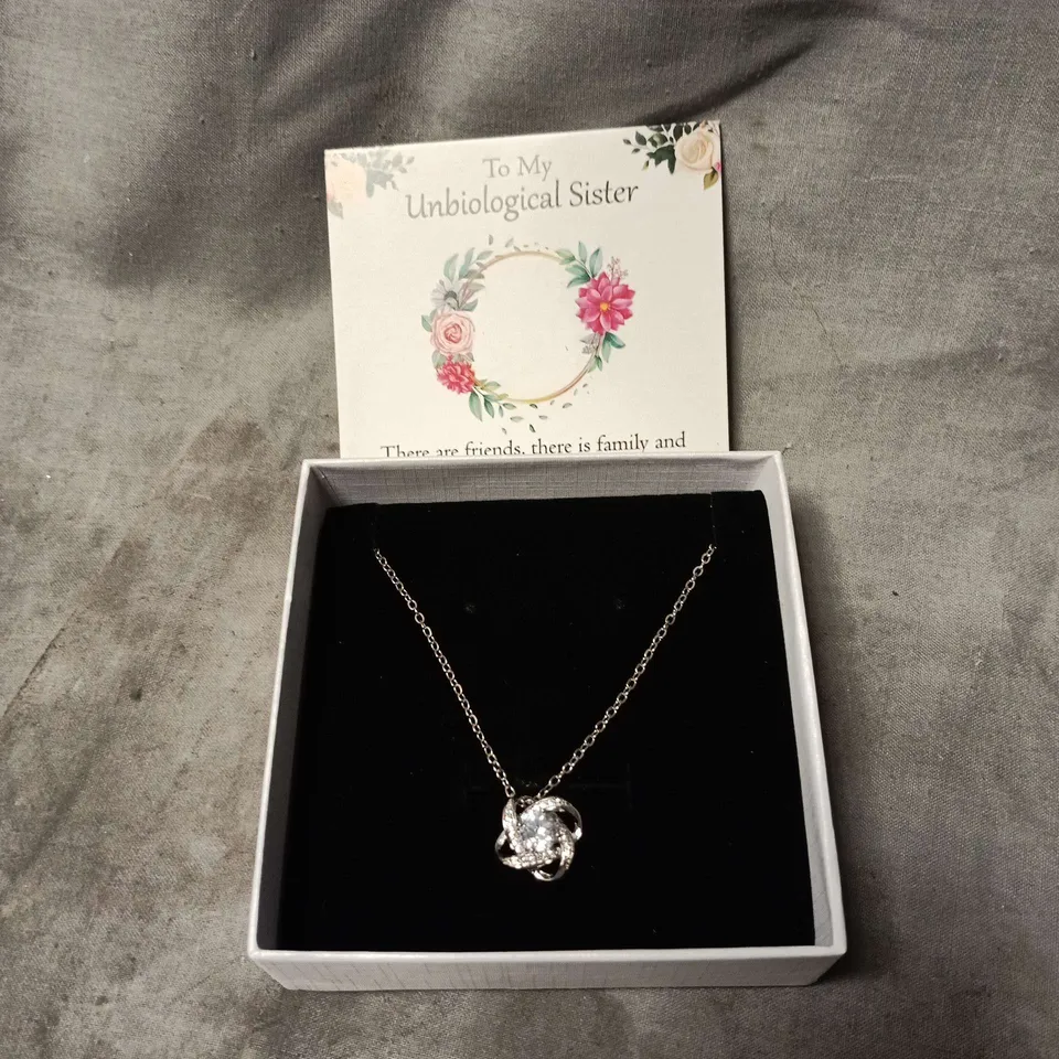 SILVER-TONE NECKLACE WITH CRYSTAL KNOT PENDANT – BOXED. GIFT CARD TO "MY UNBIOLOGICAL SISTER"