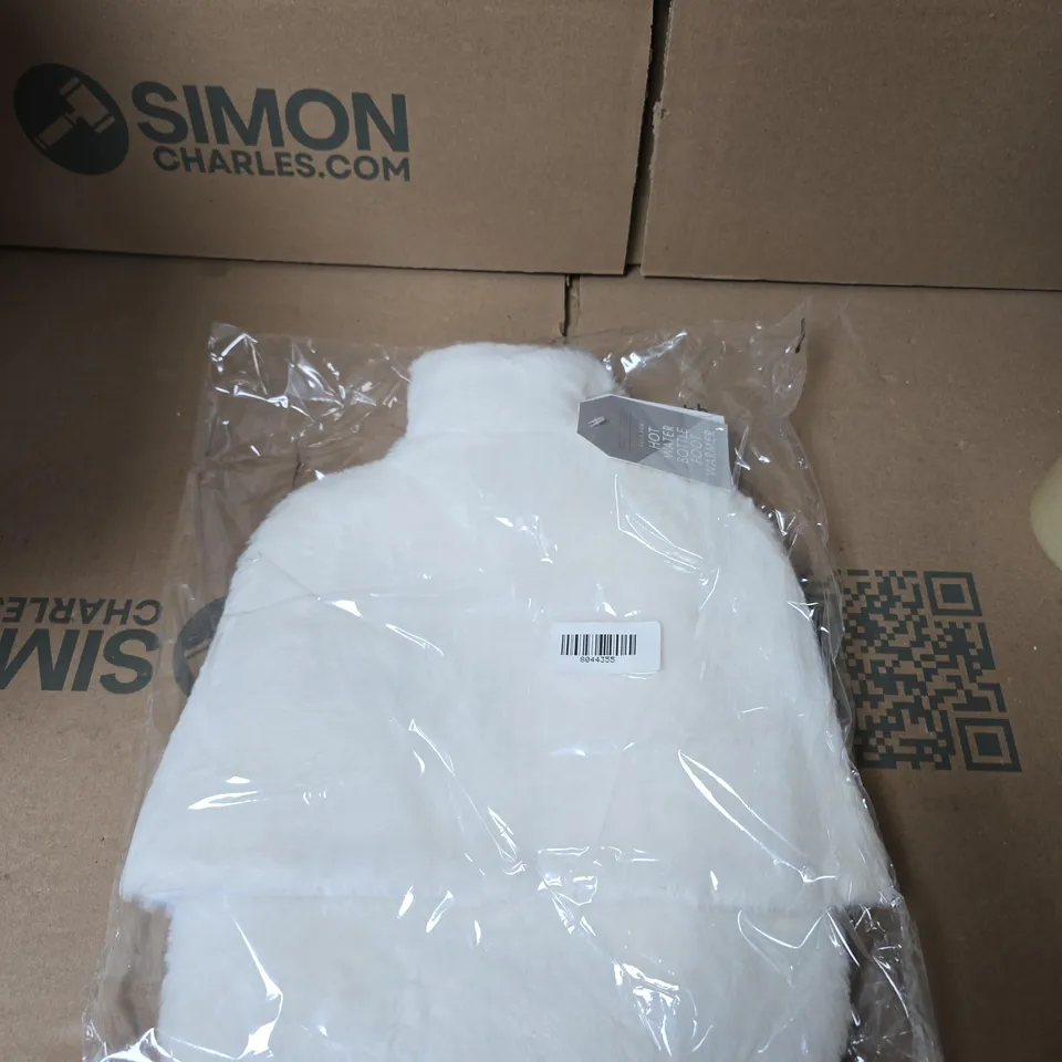 BOX OF APPROXIMATELY 12 WHITE FAUX FUR FOOT WARMER HOT WATER BOTTLES