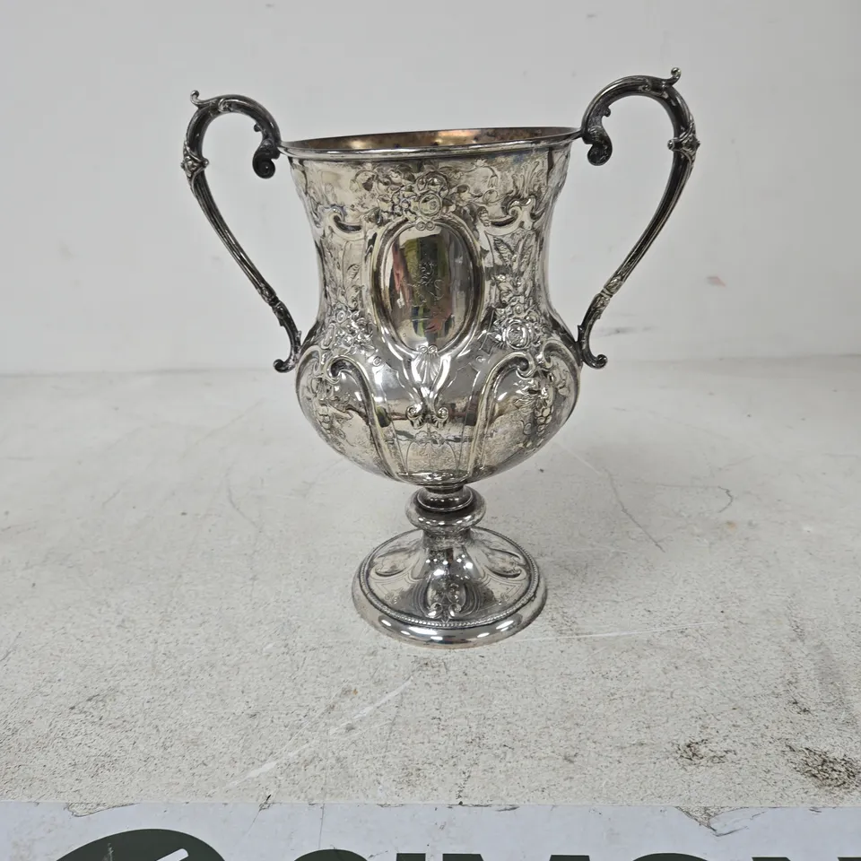 SILVER-PLATED ORNATE TROPHY CUP WITH TWIN HANDLES