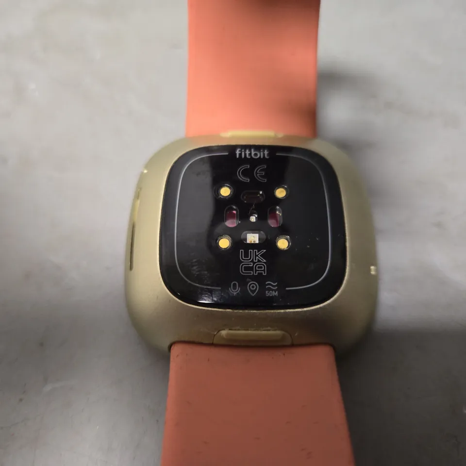 UNBOXED FITBIT IN SILVER WITH PINK RUBBER STRAP - MODEL UNSPECIFIED 