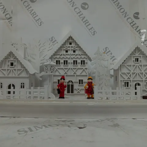 WHITE WOOD LIT VILLAGE SCENE