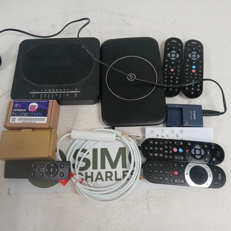 LOT OF ASSORTED HOUSEHOLD ITEMS TO INCLUDE ROUTERS, REMOTES AND CABLES