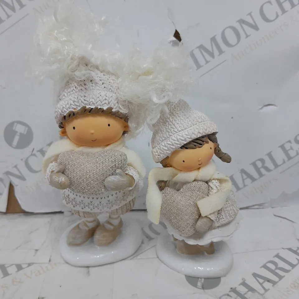 STANDING BOY AND GIRL WITH LARGE HEARTS RRP £29.99