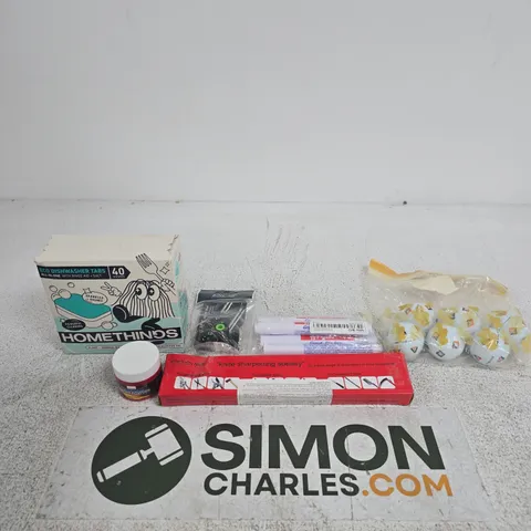 TOTE OF APPROXIMATELY 10 ASSORTED ITEMS INCLUDING GOLF BALLS, A KNIFE SHARPENER AND GROUT TILE PENS