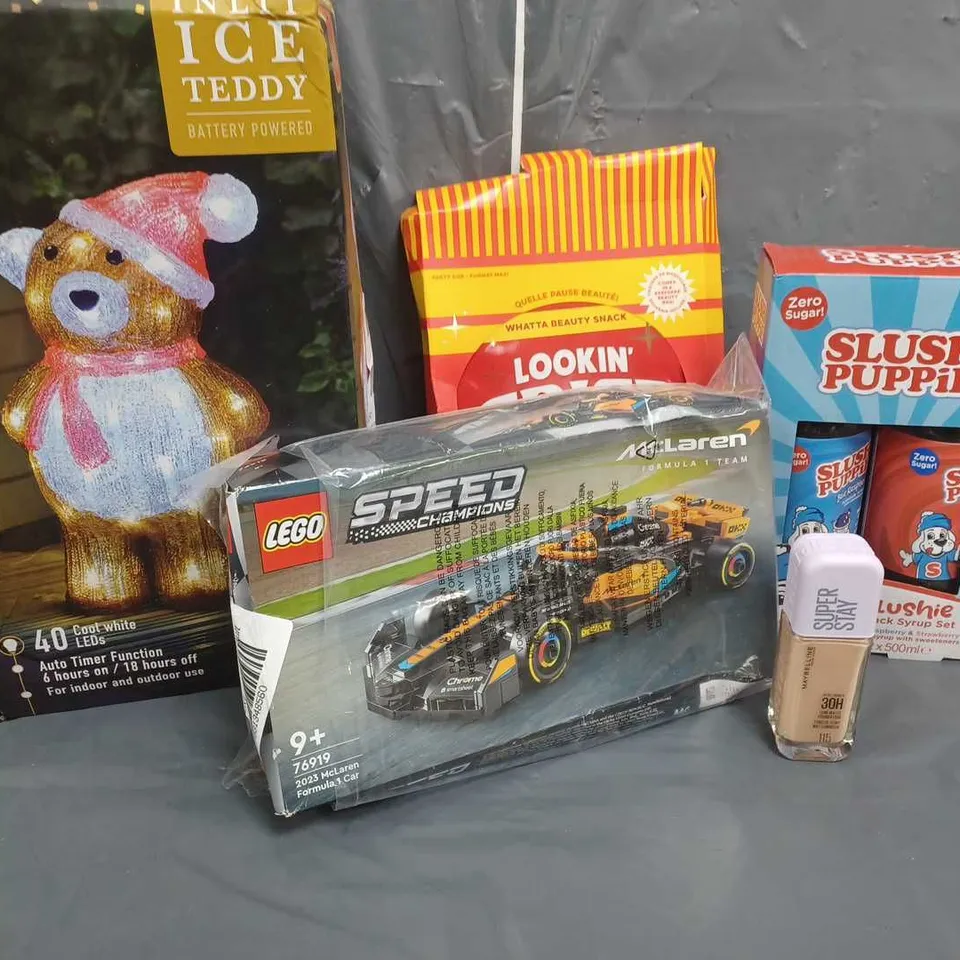 APPROXIMATELY 6 ASSORTED ITEMS TO INCLUDE LEGO SPEED CHAMPIONS 2023 MCLAREN FORMUAL1 CAR, MAYBELLINE SUPER STAY FOUNDATION, SLUSH PUPPIE SYRUP SET, THREE KINGS INLIT ICE TEDDY