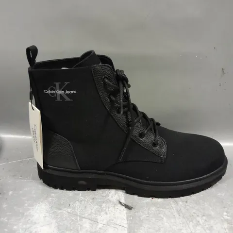 PAIR OF CALVIN KLEIN LACE UP BOOTS IN BLACK - 10.5