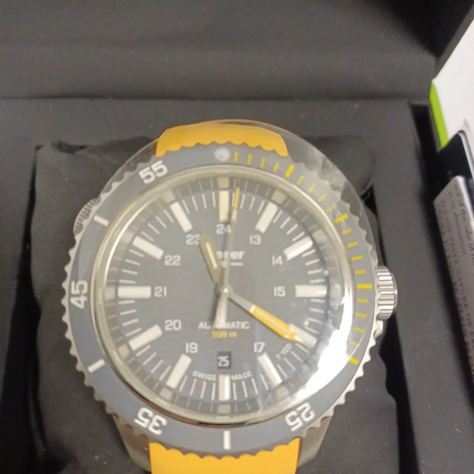 BOXED TRASER WATCH WITH YELLOW SILICONE STRAP AND CHANGEABLE SILVER LINK STRAP, AND TRASER MINI TORCH 