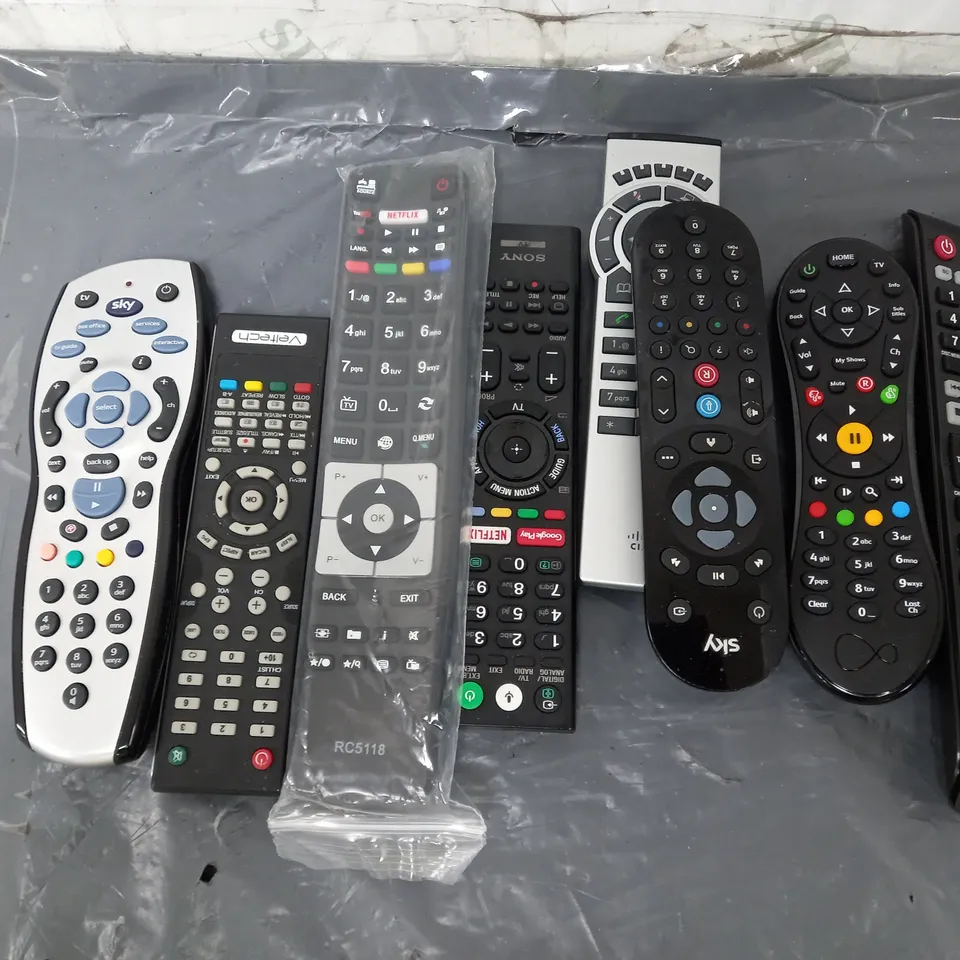 APPROXIMATELY 25 ASSORTED HOUSEHOLD ELECTRICALS TO INCLUDE SKY WIFI HUB, AMAZON FIRESTICK, LITHIUM BATTERY CHARGER, TELEVISION REMOTE CONTROLS