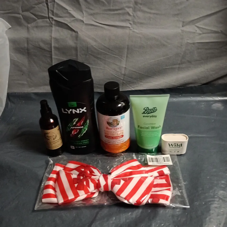 APPROXIMATELY 20 HEALTH AND BEAUTY PRODUCTS TO INCLUDE LYNX AFRICA SHOWER GEL, WILD DEODORANT REFILL AND A S STRIPED RED AND WHITE BOW