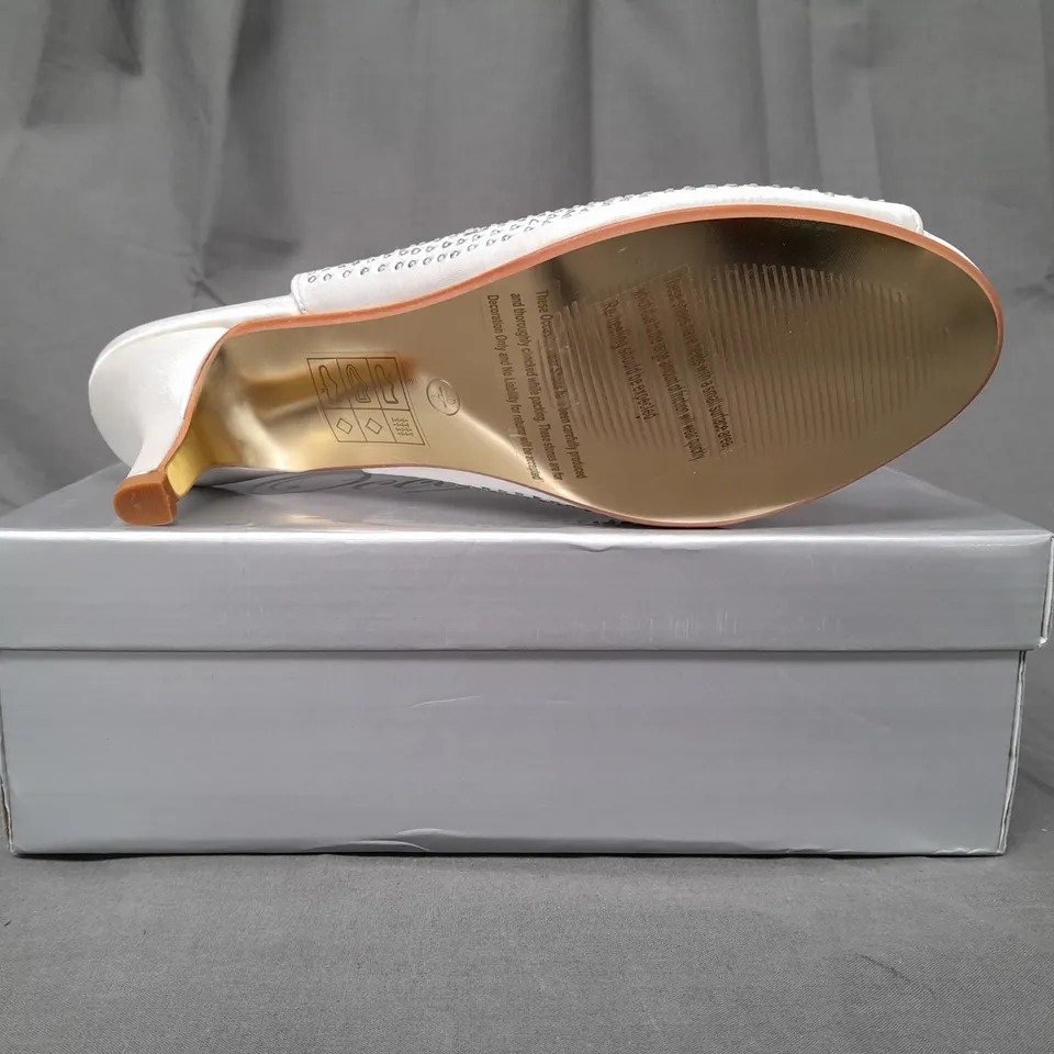 BOXED PAIR OF OCCASIONS BY CASANDRA OPEN TOE LOW HEEL ANKLE STRAP SHOES IN IVORY SATIN W. JEWEL EFFECT SIZE 7