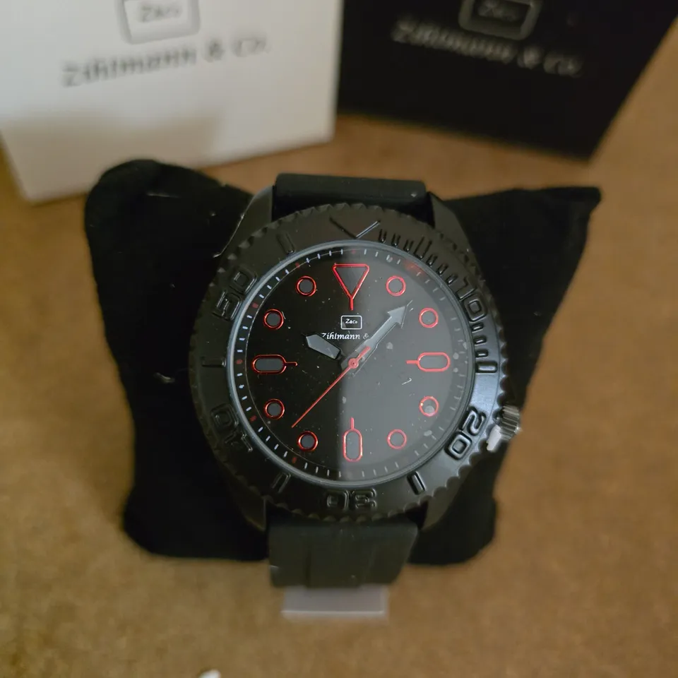 ZIHMANN & CO. DIVER-STYLE WRISTWATCH, BLACK WITH RED ACCENTS