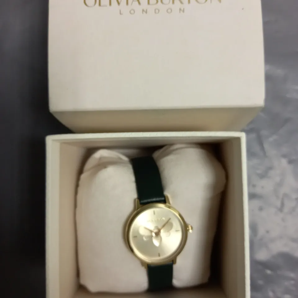 BOXED OLIVIA BURTON LONDON LADIES WATCH WITH GOLD COLOURED BEE DESIGN FACE AND GREEN LEATHER STRAP