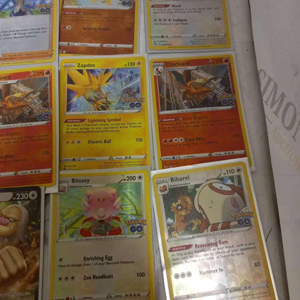 LOT OF 24 ASSORTED POKEMON CARDS