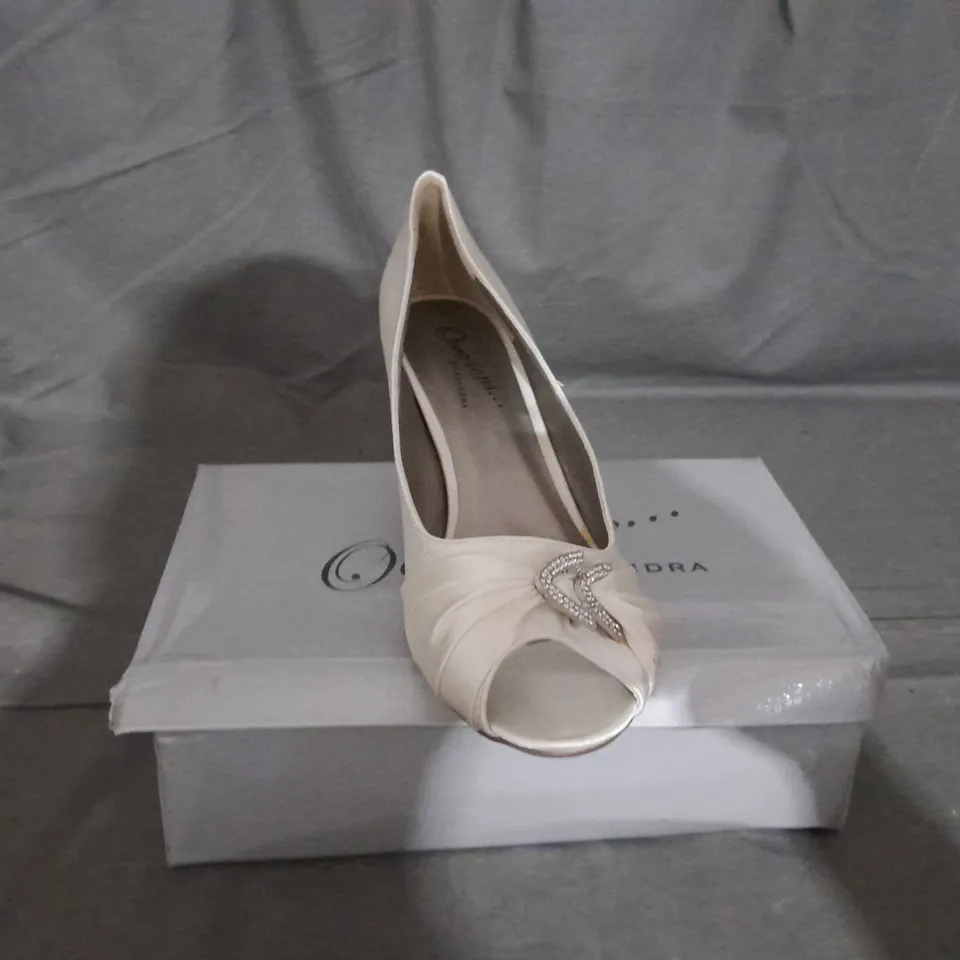 APPROXIMATELY 11 BOXED PAIR OF CASANDRA HEELED SHOES IN IVORY VARIOUS SIZES TO INCLUDE SIZE 8 
