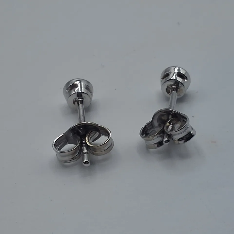 18CT WHITE GOLD RUB OVER STUD EARRINGS SET WITH NATURAL DIAMONDS