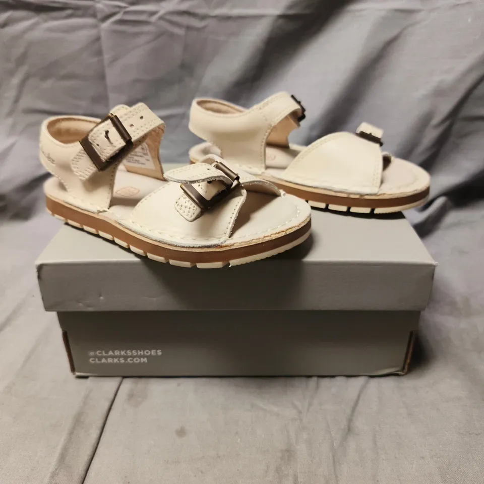 BOXED PAIR OF CLARKS KIDS OPEN TOE SANDALS IN OFF-WHITE SIZE UK 7.5