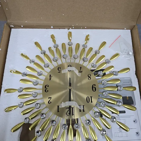 GOLD TONE SUNBURST WALL CLOCK WITH CRYSTAL ACCENTS