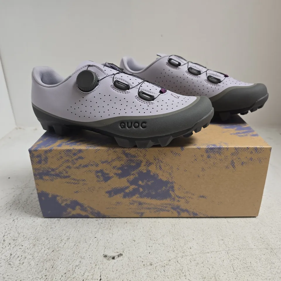 BOXED PAIR OF QUOC GRAN TOURER III TRAINERS IN LILAC HAZE SIZE EU 42