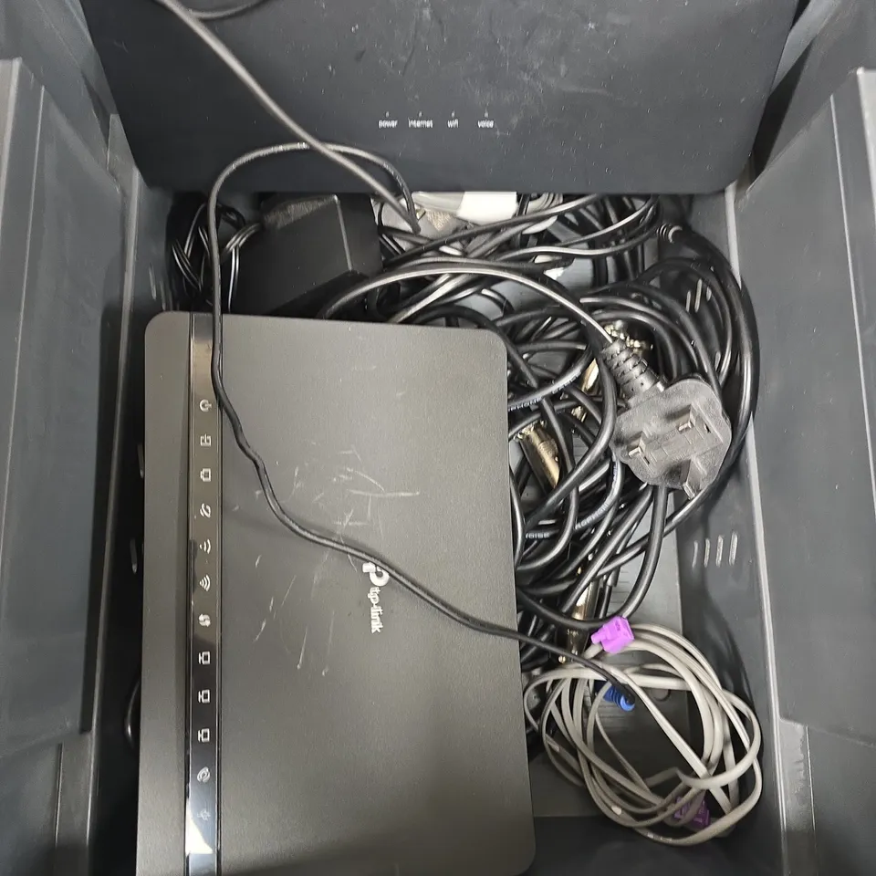 BOX OF ASSORTED CABLES AND MODEMS 