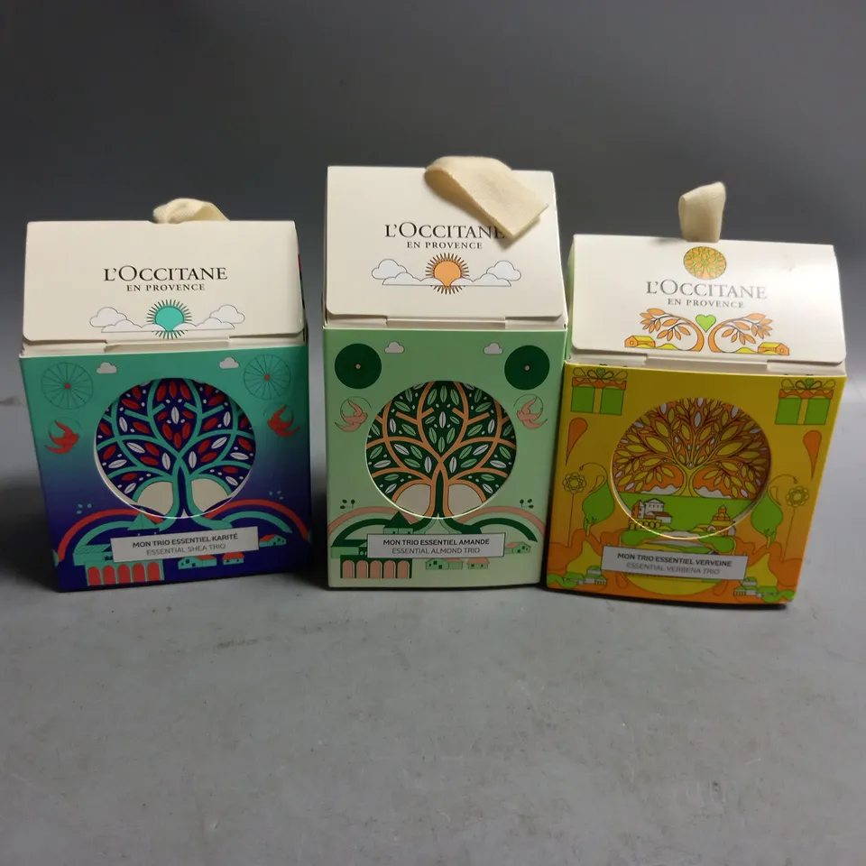 3 BOXED L'OCCITANE GIFT SETS TO INCLUDE ESSENTIAL SHEA TRIO, ESSENTIAL ALMOND TRIO, ESSENTIAL VERBENA TRIO