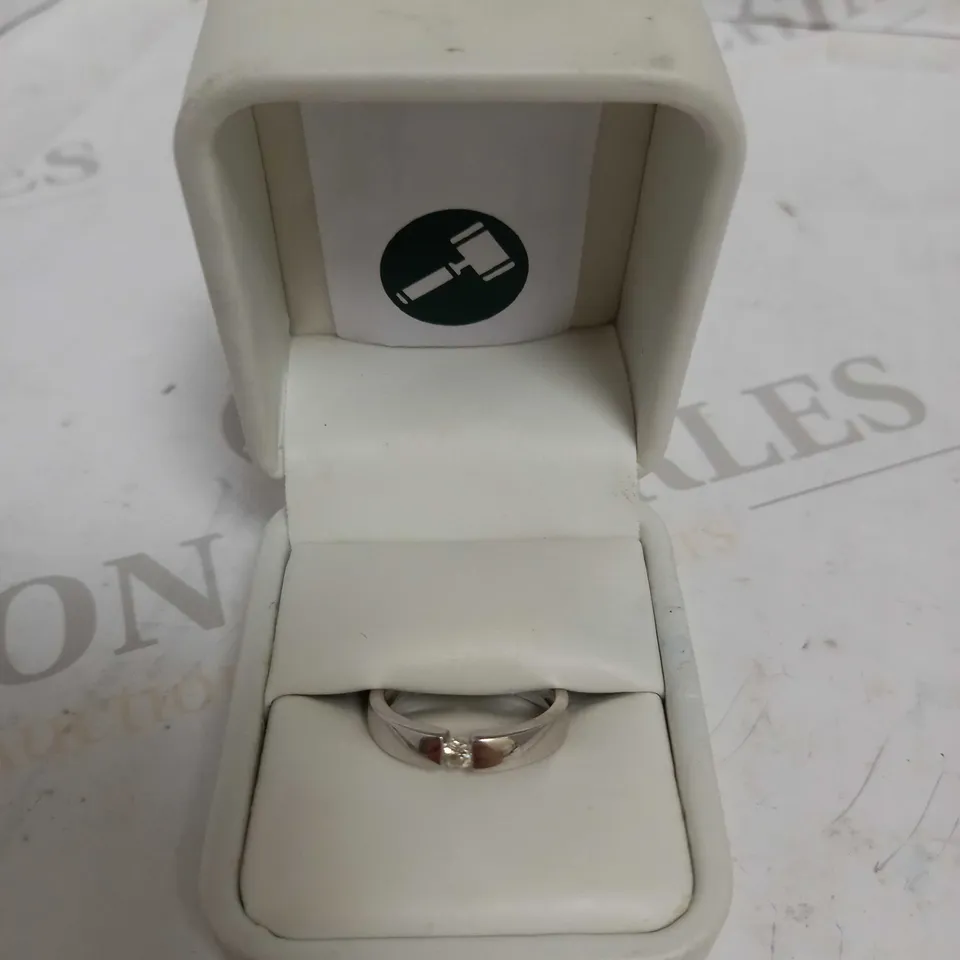 DESIGNER 18CT WHITE GOLD SOLITAIRE RING TENSION SET WITH A DIAMOND