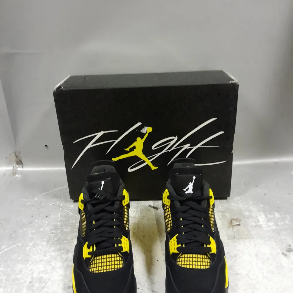 BOXED PAIR OF NIKE AIR JORDAN 4 RETRO BLACK / YELLOW UK 6.5