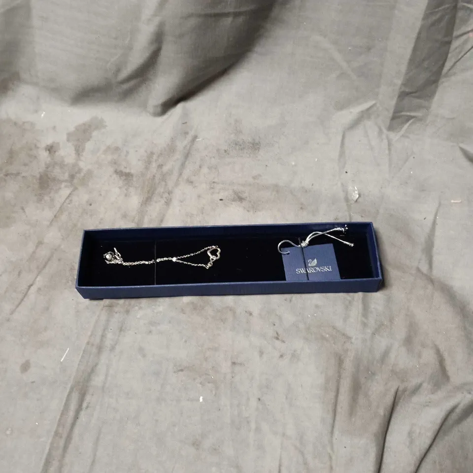 SWAROVSKI TENNIS BRACELET WITH LOVE HEART, IN BOX