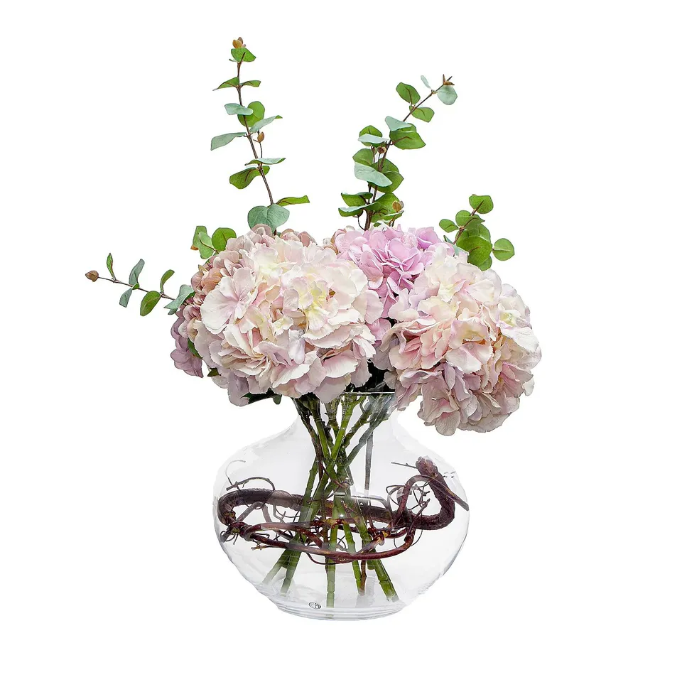 PEONY HYDRANGEAS AND EUCALPTUS WITH WILLOW TWIG IN LARGE FISH BOWL LILAC
