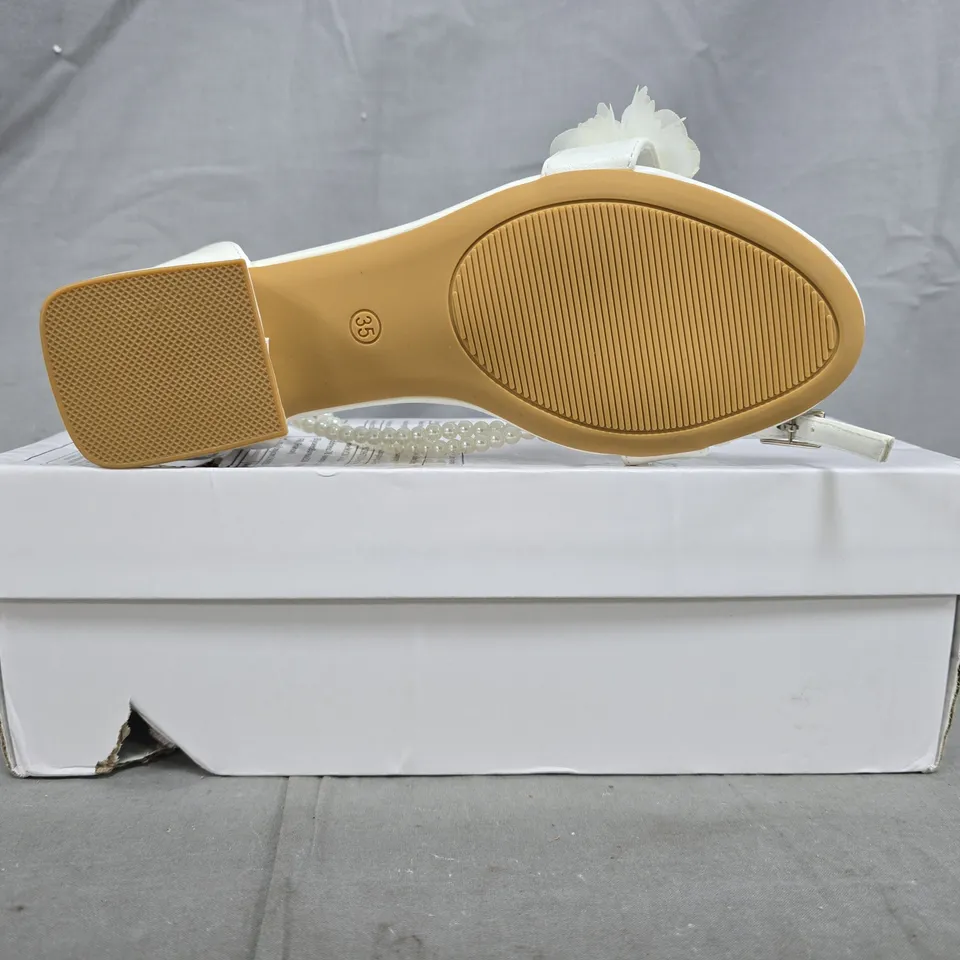 BOXED PAIR OF UNBRANDED LOW BLOCK HEEL OPEN TOE BRIDAL SANDALS IN IVORY SIZE EU 35