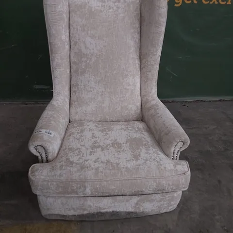 DESIGNER HIGH BACKED WINGED EASY CHAIR SILVER FABRIC WITH STUDDED DETAIL