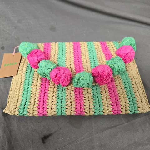 BODEN POMPON CLUTCH BAG – MULTI-COLOUR STRAW WITH PINK & GREEN POM-POMS