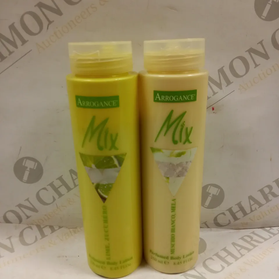 BOX OF APPROXIMATELY 30 ARROGANCE MIX PERFUMED BODY LOTIONS TO INCLUDE LIME & MUSCHIO BIANCO - 250ML