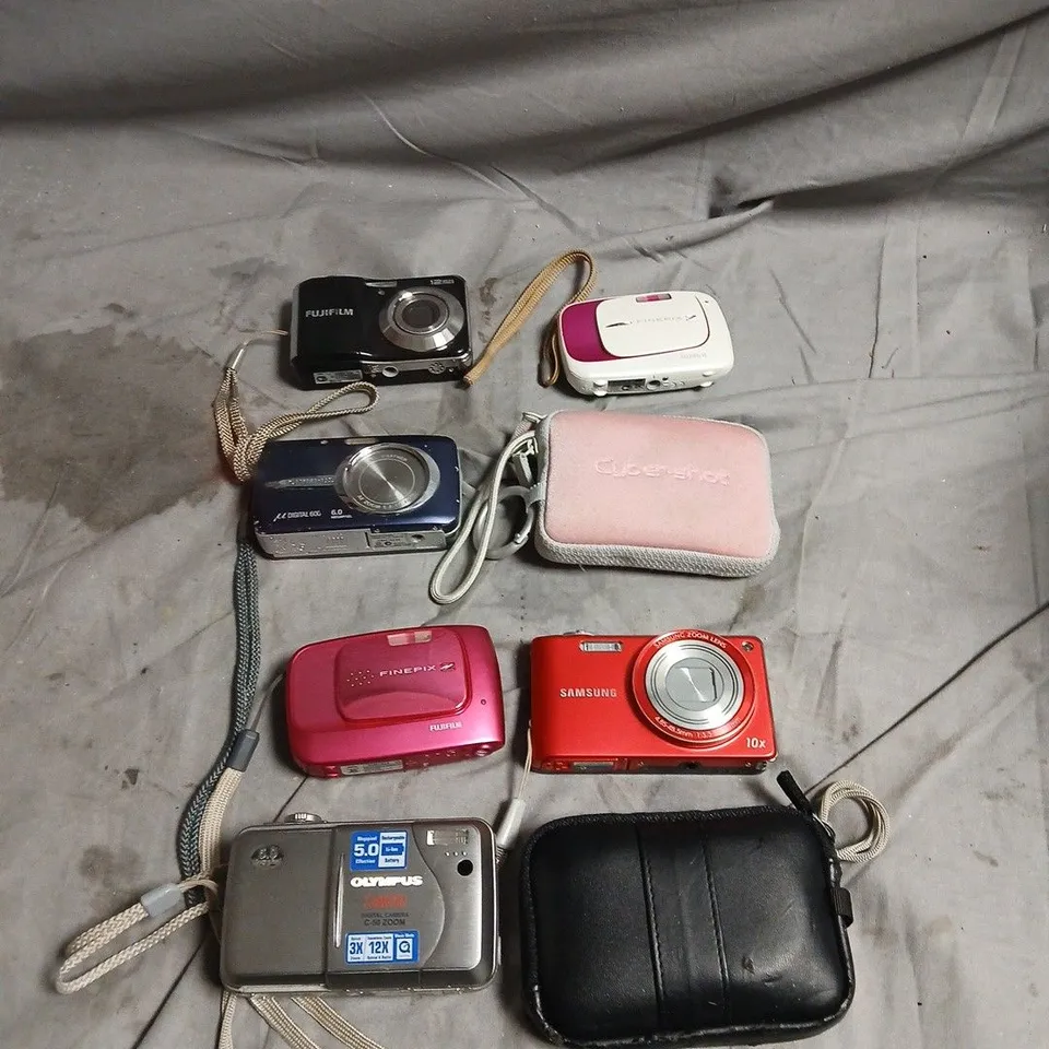 APPROXIMATELY 8 ASSORTED CAMERAS INCLUDING FUJIFILM FINE PIX AND OLYMPUS C 50 
