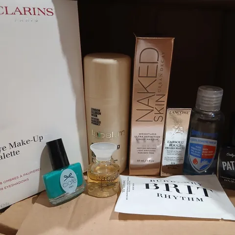 NINE ASSORTED BEAUTY PRODUCTS TO INCLUDE; CLARINET EYE MAKEUP UP PALLETTE, LANCOME DRAMA MATTE, CIATE NAIL VARNISH, LABEL M BRIGHTENING BLONDE BALM, URBAN DECAY NAKED SKIN WEIGHLESS UKTRA HIGH DEFINIT