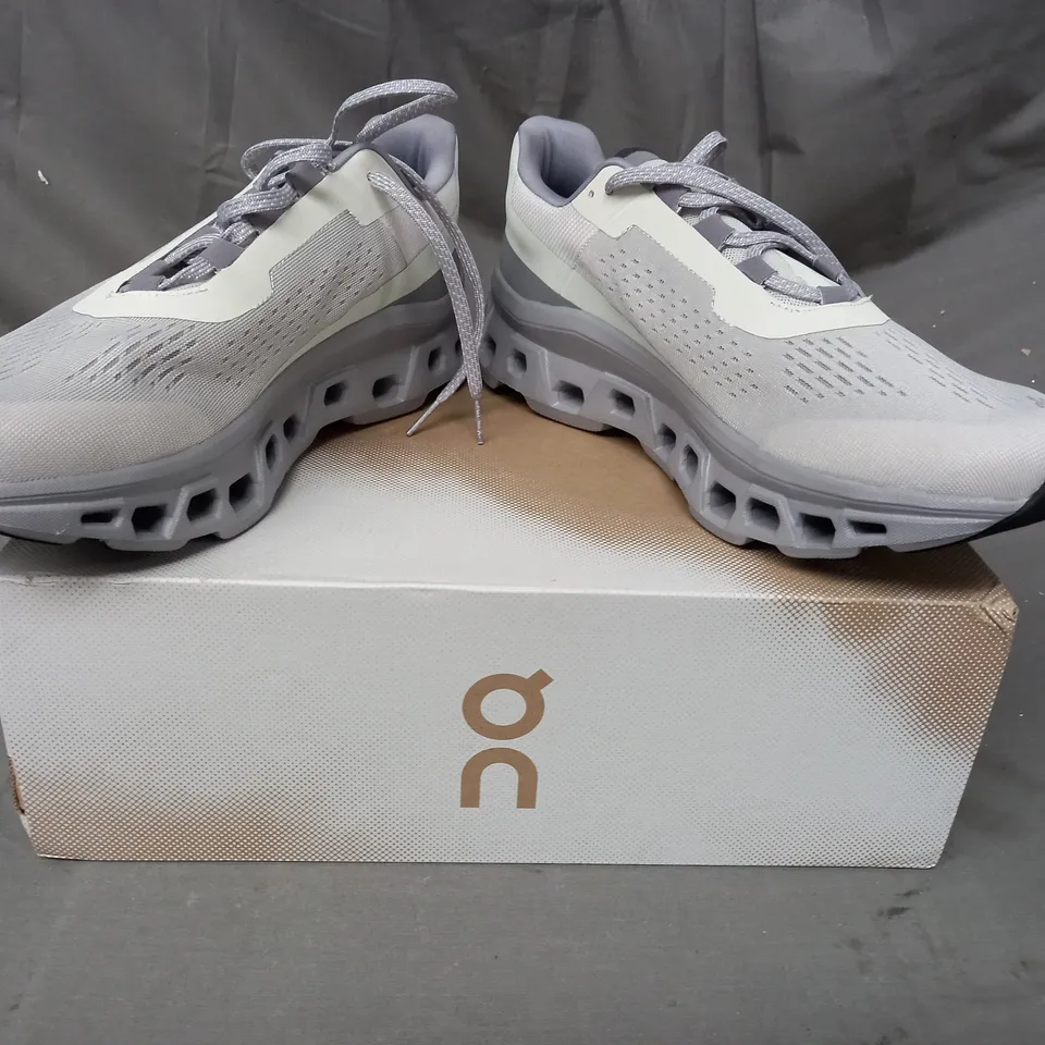 BOXED PAIR OF ON CLOUDMONSTER SHOES IN ICE/ALLOY UK SIZE 11