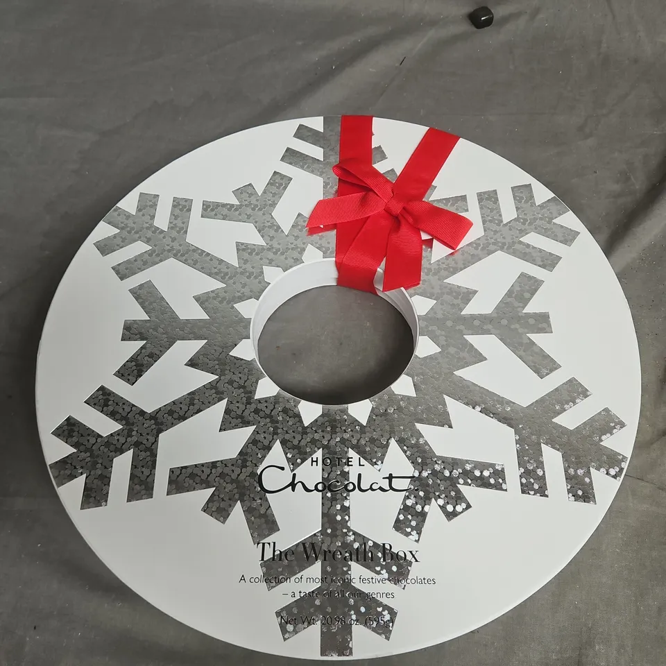 HOTEL CHOCOLAT THE WREATH BOX – FESTIVE CHOCOLATES IN CIRCULAR TIN WITH RED RIBBON