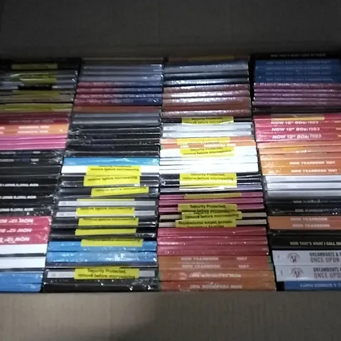 APPROXIMATELY 100 ASSORTED CDS AND DVDS TO INCLUDE NOW MUSIC 18, NOW YEARBOOK, AND NOW THAT'S WHAT I CALL ETC.