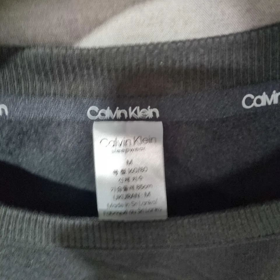 CALVIN KLEIN BLACK LONG-SLEEVE TOP – SIZE M
