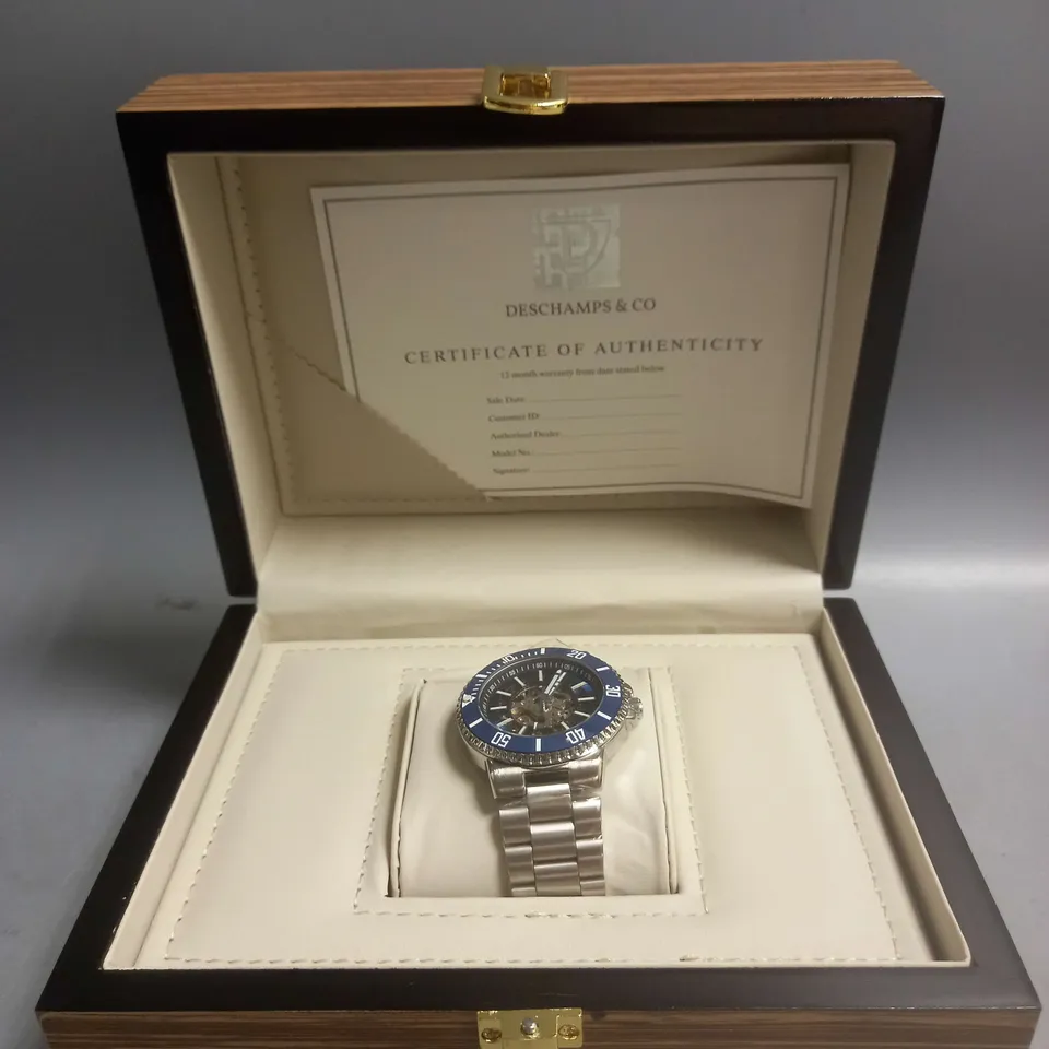 BOXED DECHAMPS&CO MECHANICAL WATCH IN BLUE/SILVER