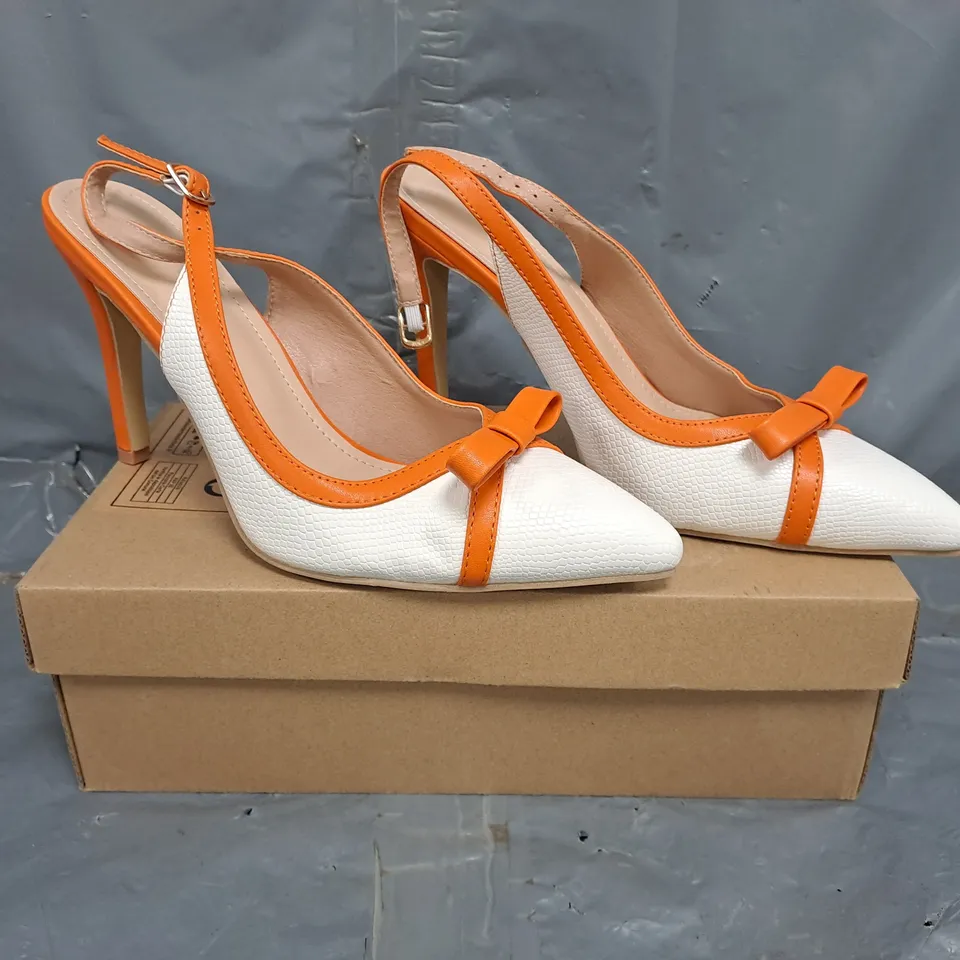BOXED PAIR OF UNBRANDED POINTED TOE HEELED SHOES IN WHITE/ORANGE SIZE EU 42
