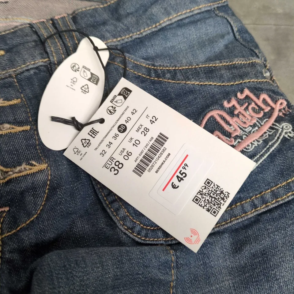 BERSHKA DENIM JEANS – BLUE WASH WITH BACK POCKET GRAPHICS VON DUTCH SIZE 10 UK