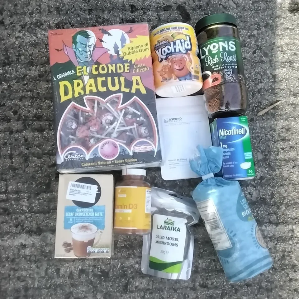 PALLET OF ASSORTED ITEMS INCLUDING DRACULA LOLLIPOPS, NESCAFE DECAF UNSWEETENED, PEACH MANGO KOOL AID, DRIED MOREL MUSHROOMS, LYONS INSTANT COFFEE, LIGHTLY SALTED RICE CAKES
