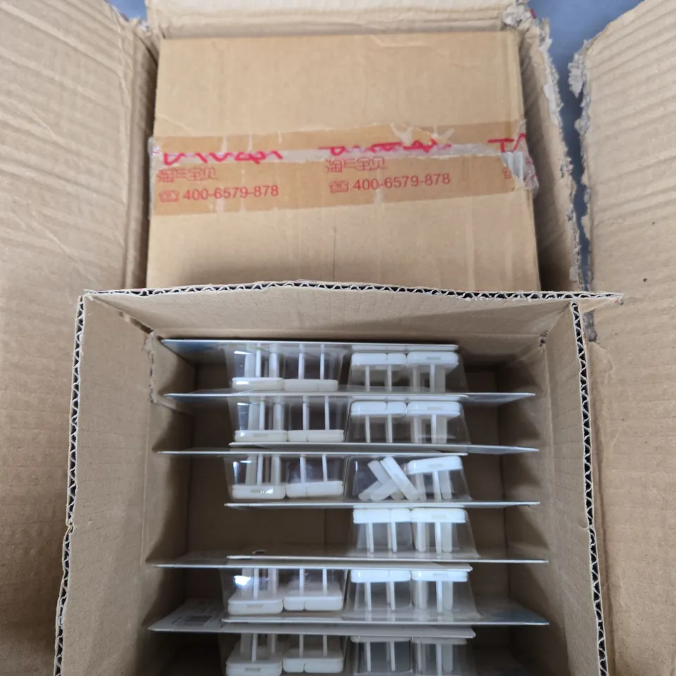 APPROXIMATELY 35 NON UK SAFE SOCKET PROTECTIVE COVERS 