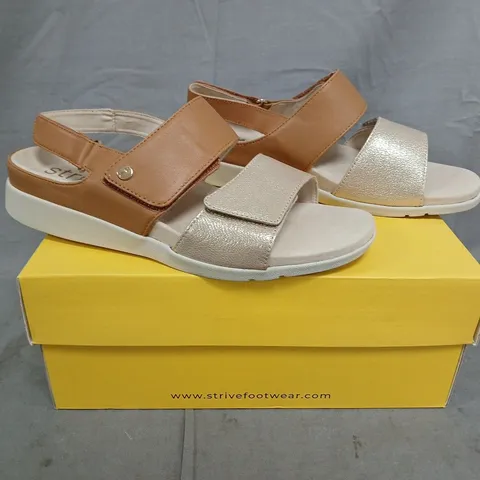 BOXED PAIR OF STRIVE OPEN TOE SANDALS IN TAN/GOLD SIZE UK 7