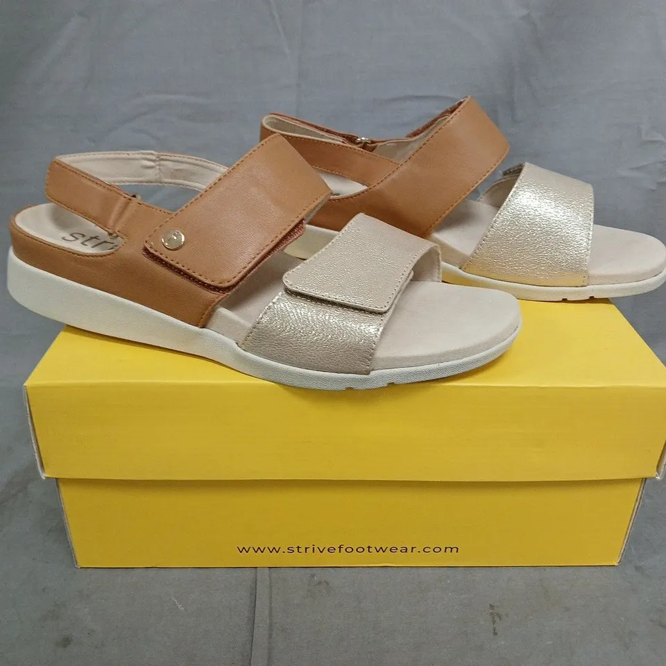 BOXED PAIR OF STRIVE OPEN TOE SANDALS IN TAN/GOLD SIZE UK 7