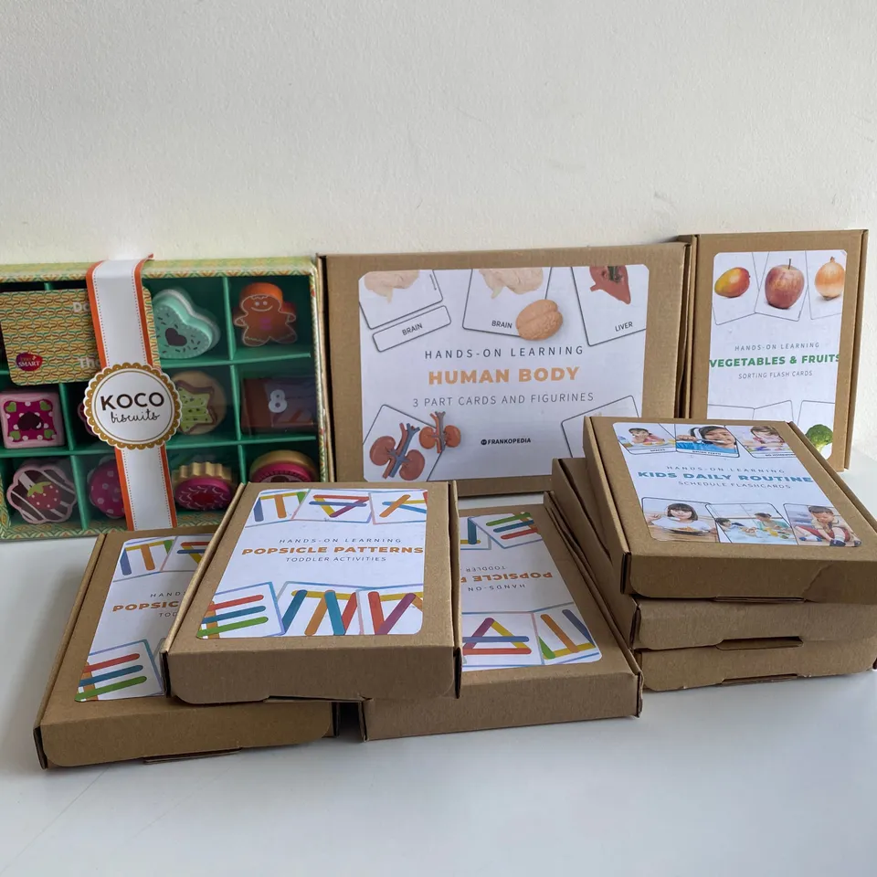 BOX OF 9 BRAND NEW ITEMS TO INCLUDE: KOCO BISCUITS SET, HUMAN BODY SET, KIDS DAILY ROUTINE SETS ETC 