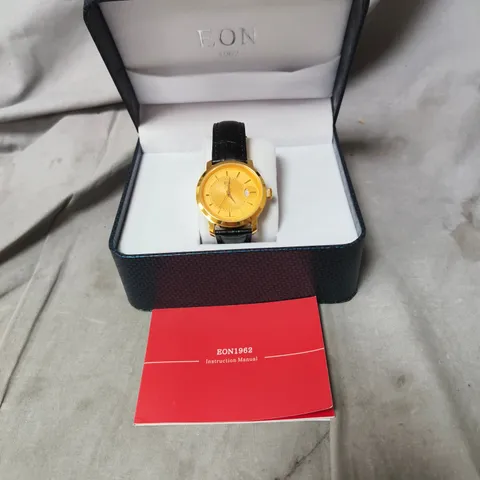 EON GOLD-TONE WRISTWATCH WITH BLACK LEATHER STRAP – BOXED